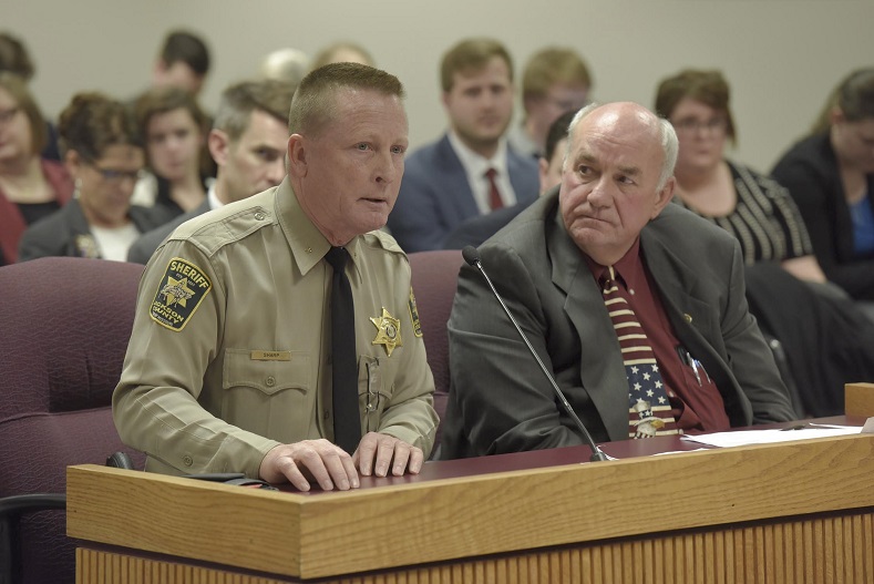 Representative Jim Neely (right) listens as Jackson County Sheriff Mike Sharp (left) testifies in favor of Neely's medical marijuana legislation, HB 437. Jackson said he has a nephew that could benefit from medical marijuana. (photo; Tim Bommel, Missouri House Communications)